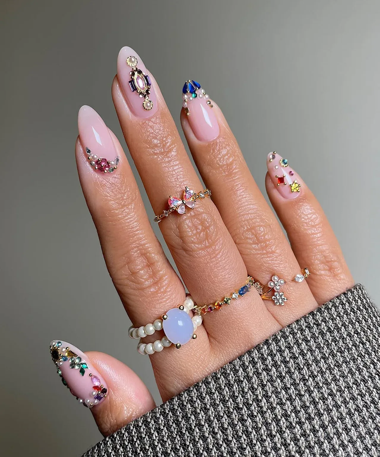 Are there any new embellishments or accessories popular for summer nails