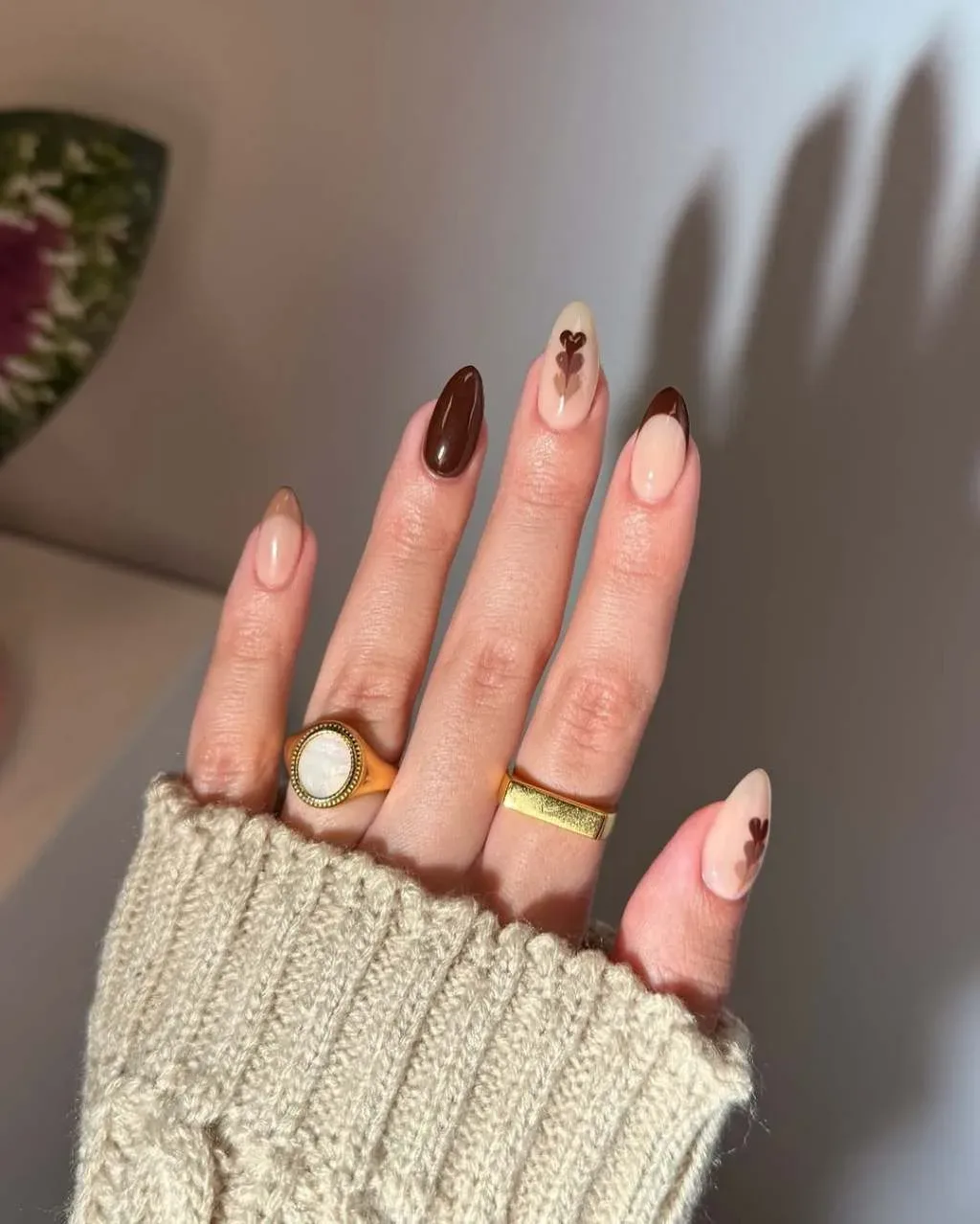 How can one achieve a classy brown nail look