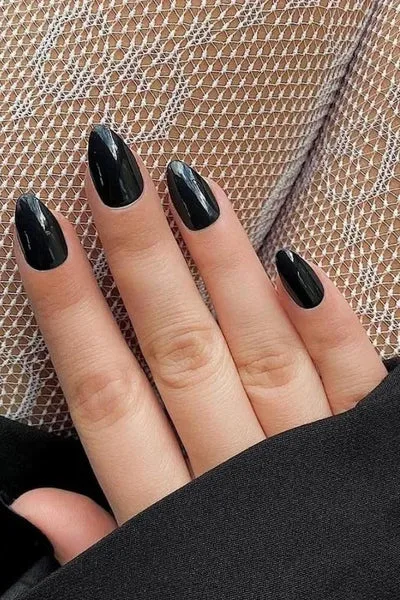 How can one achieve a glossy black nail design