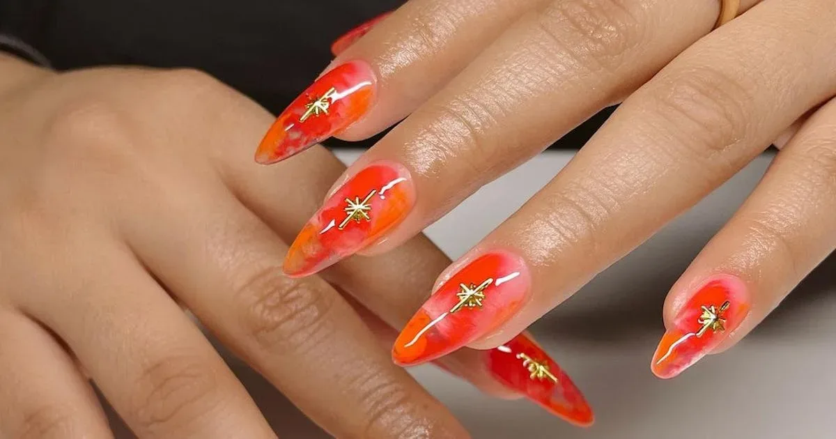 How can you incorporate different shades into orange nail designs
