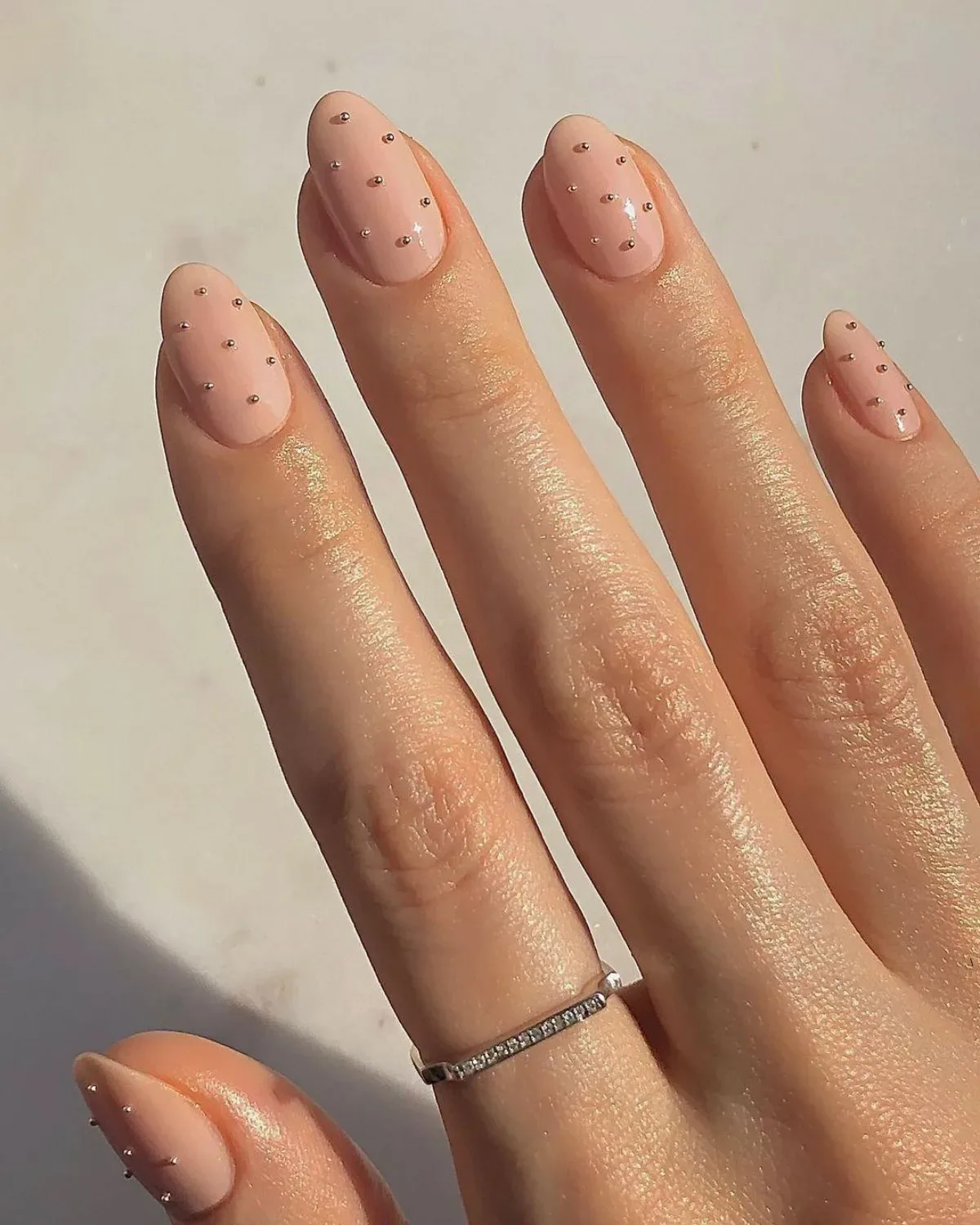 What are some trending nude nail designs for a modern manicure