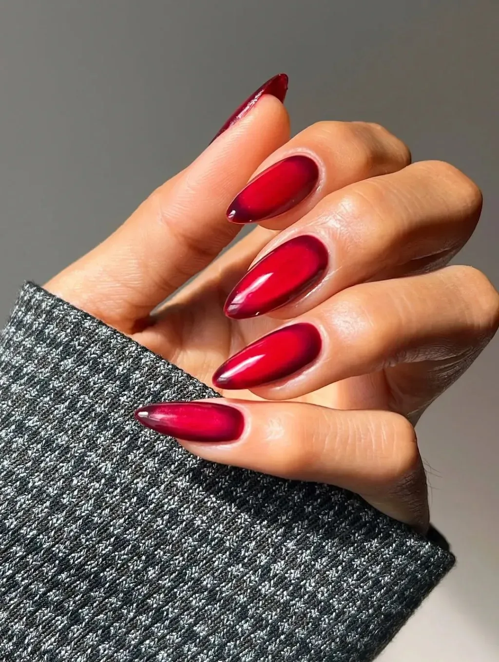 What red nail designs can create an edgy style